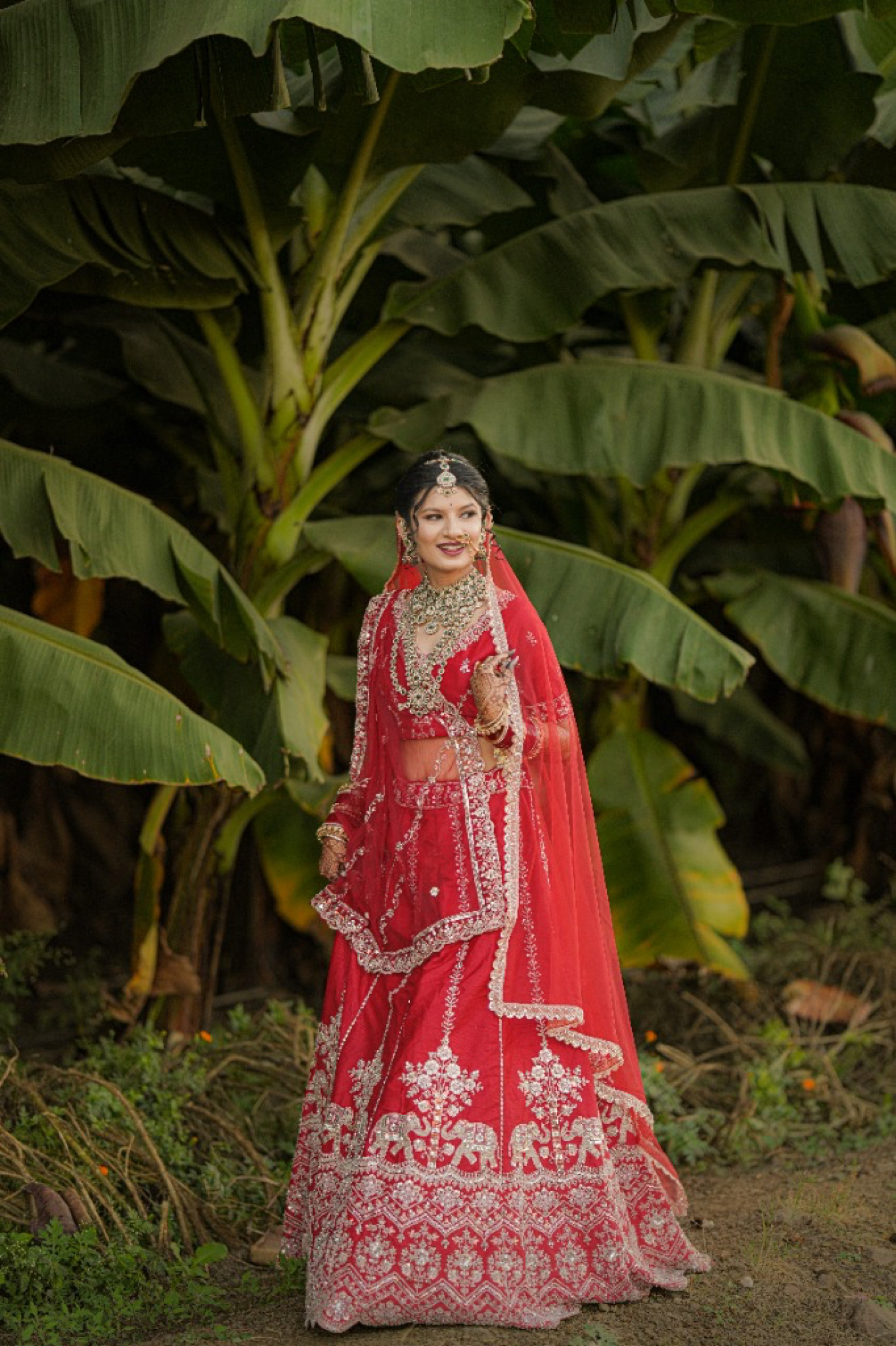 Aarya in handcrafted vermilion bridal lehenga